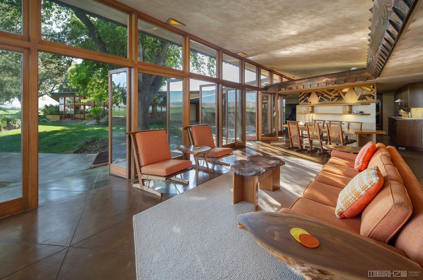 The family room with back doors open leading to the backyard