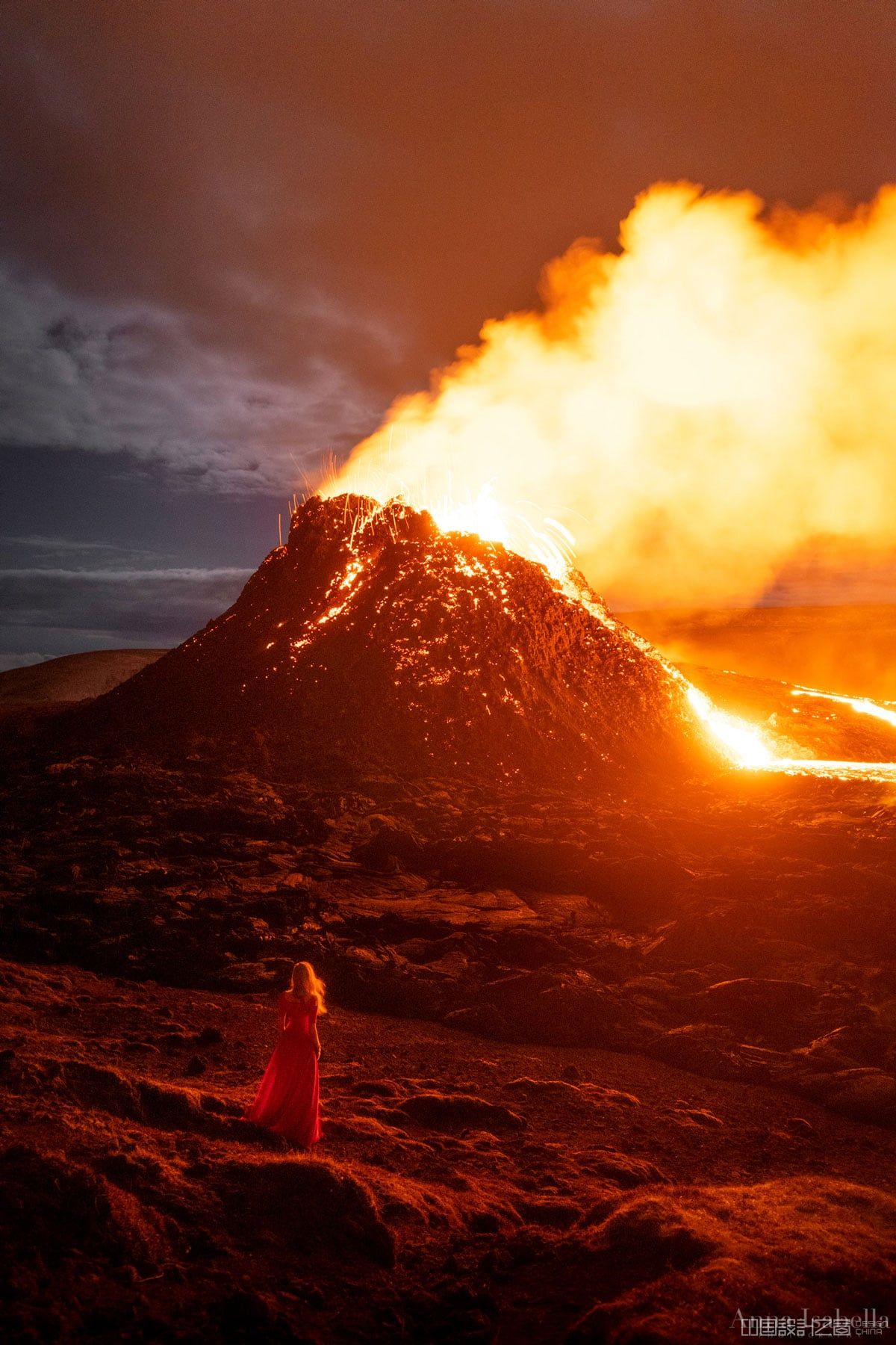 Portrait of a Woman Next to Erupting Volcano in Iceland