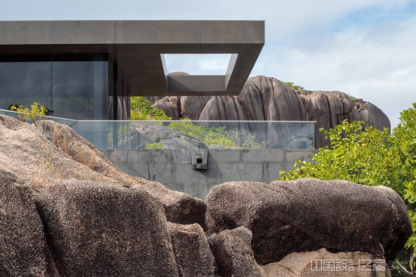 four angular holiday homes nestle into granite outcrops in the seychelles