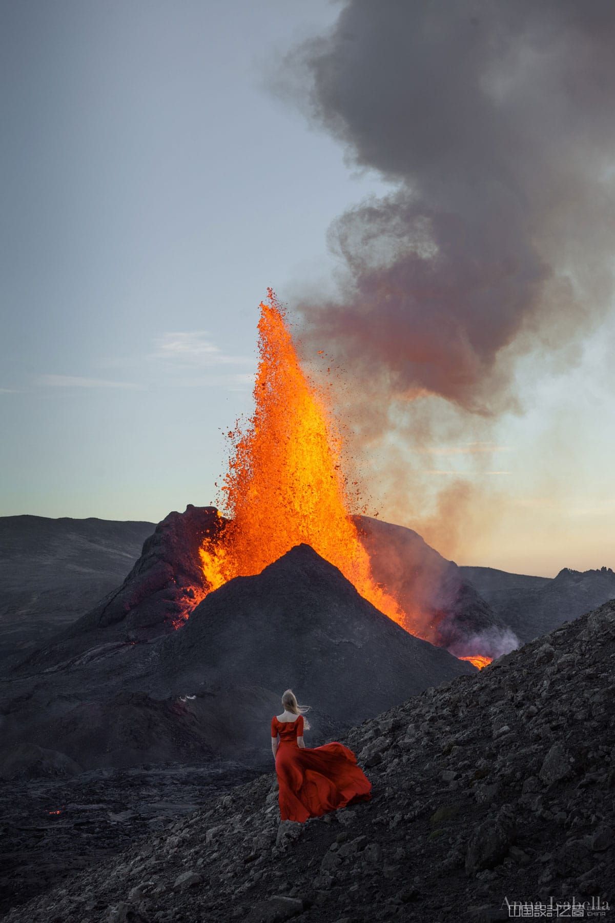 Woman in Red Dress Posing in Front of Fagradalsfjall Volcano in Iceland