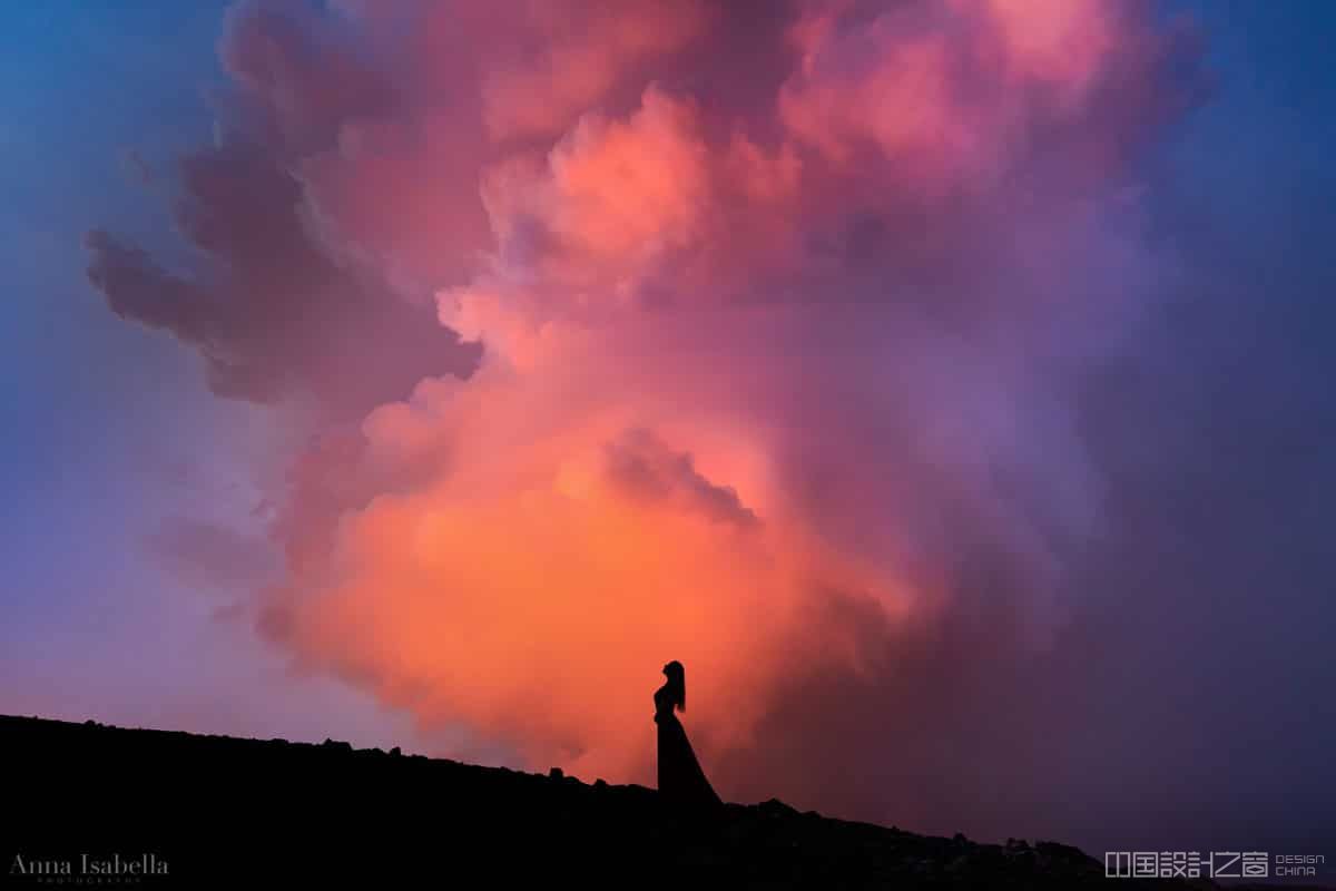 Woman Posing in front of Smoke From Erupting Volcano