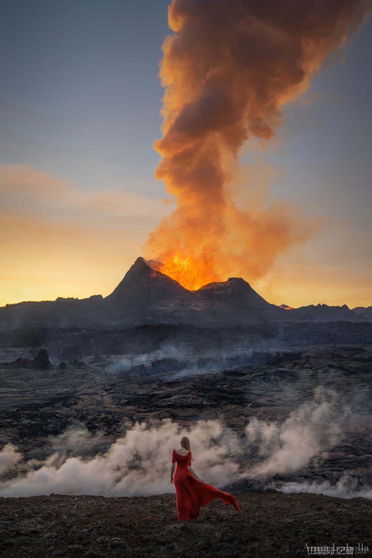 Woman in Red Dress Posing in Front of Fagradalsfjall Volcano in Iceland