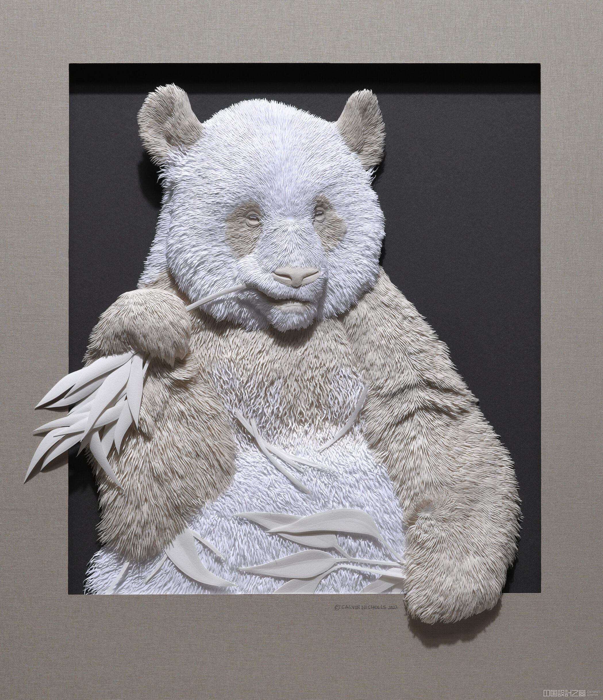 A sculpture of a panda made from paper.